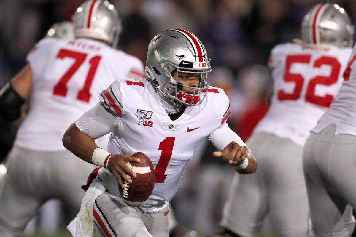 Ohio State quarterback Justin Fields scrambles during the Buckeyes' 52-3 victory over Northwestern on Oct. 18, 2019, in Evanston, Ill.