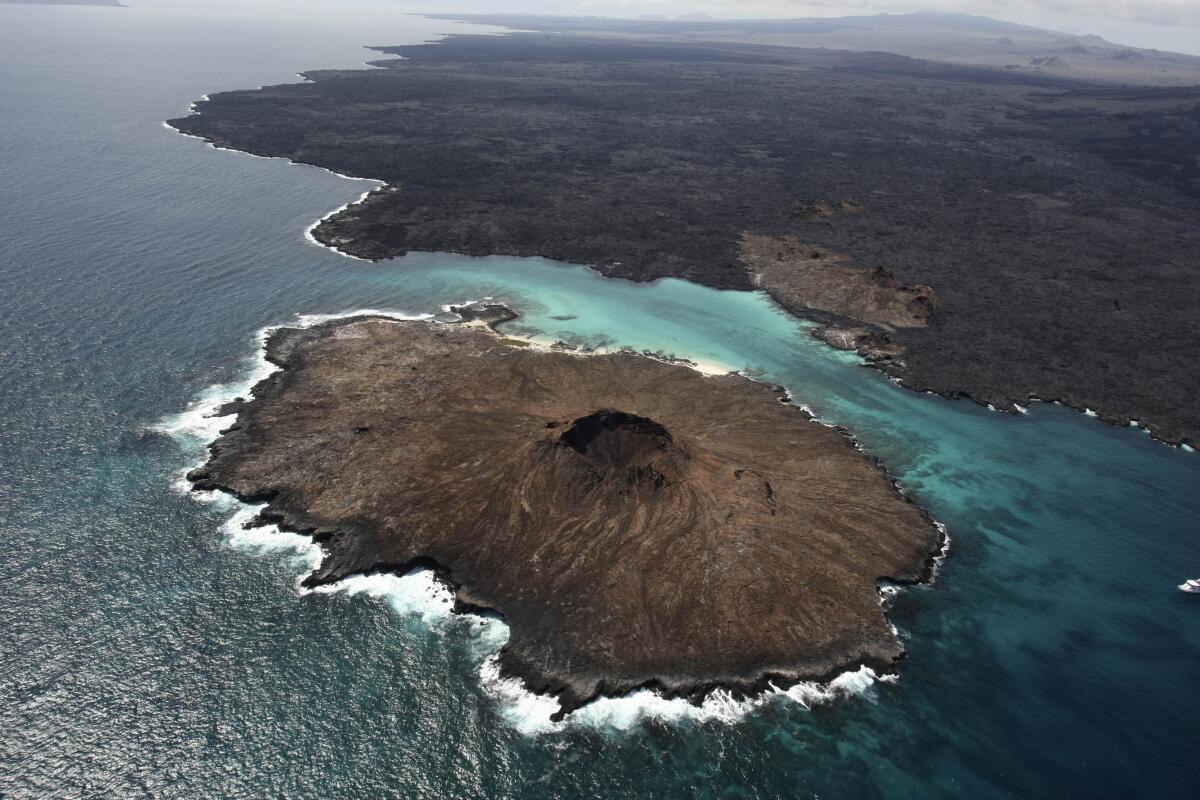 FILE - An aerial view of Sombrero Chino Island, Galapagos Islands, Ecuador, Jan. 15, 2011. Ecuador, Colombia, Costa Rica and Panama announced Tuesday, Nov. 2, 2021, that they will expand and join their marine reserves to create a vast corridor that will connect the Galapagos Islands in Ecuador with Colombia's Malpelo Island and the Cocos and Coiba Islands in Costa Rican and Panamanian waters in the Pacific Ocean in hopes of protecting sea turtles, tuna, squid, hammerhead sharks and other species. (AP Photo/Dolores Ochoa, File)
