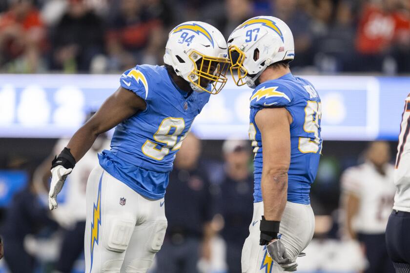 Chargers linebackers Chris Rumph II (94) and Joey Bosa (97) celebrate during their game against the Chicago Bears.