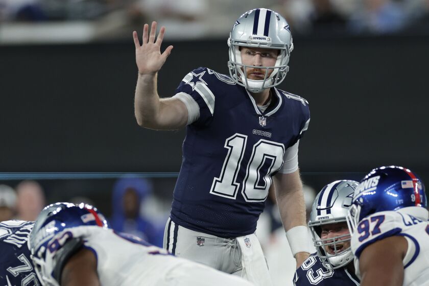 Dallas Cowboys quarterback Cooper Rush (10) motions at the line of scrimmage against the New York Giants during the second quarter of an NFL football game, Monday, Sept. 26, 2022, in East Rutherford, N.J. (AP Photo/Adam Hunger)