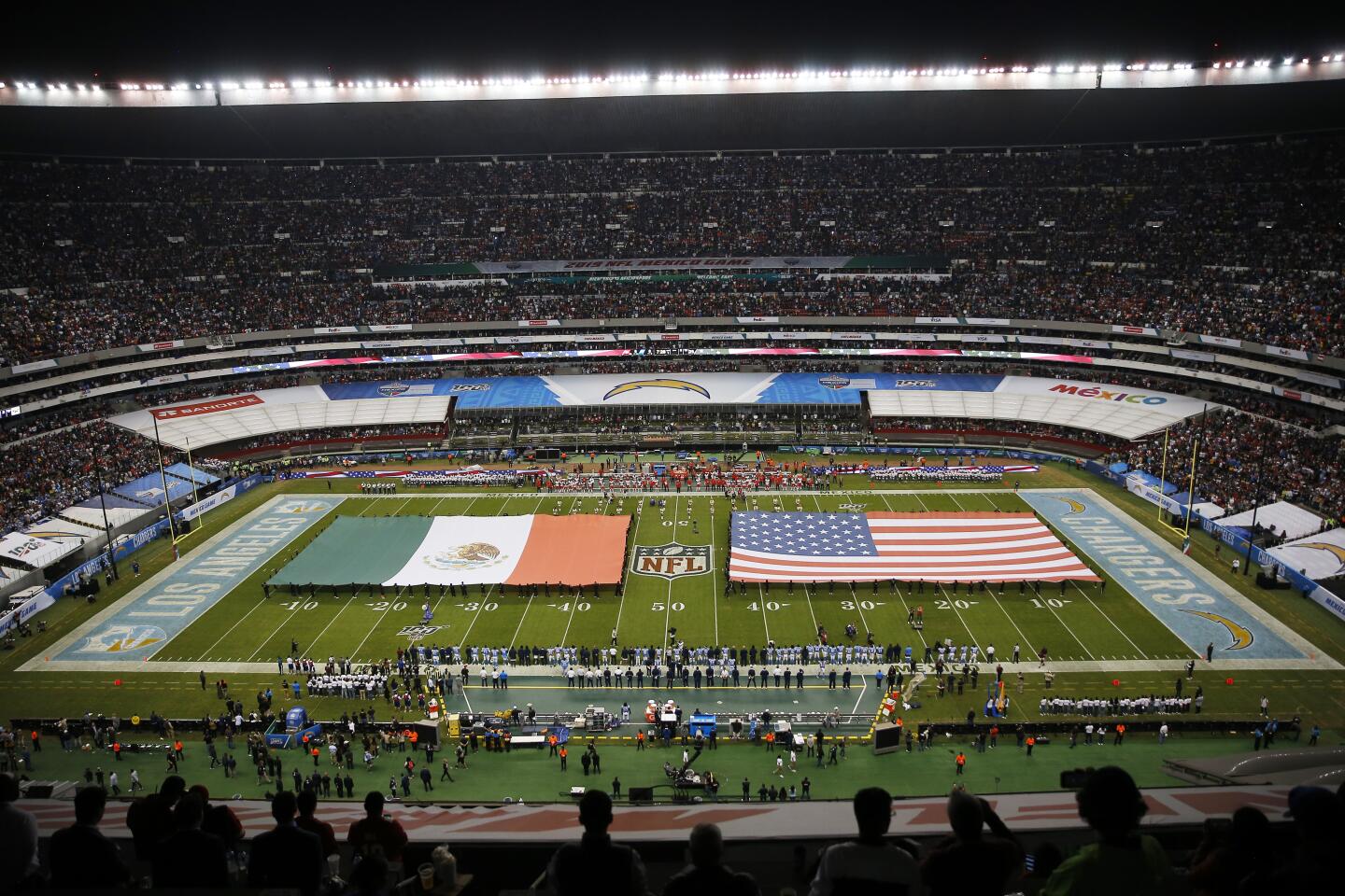 The flags of Mexico and the United States cover the field before an NFL game between the Los Angeles Chargers and the Kansas City Chiefs at Estadio Azteca on Nov. 18 in Mexico City.