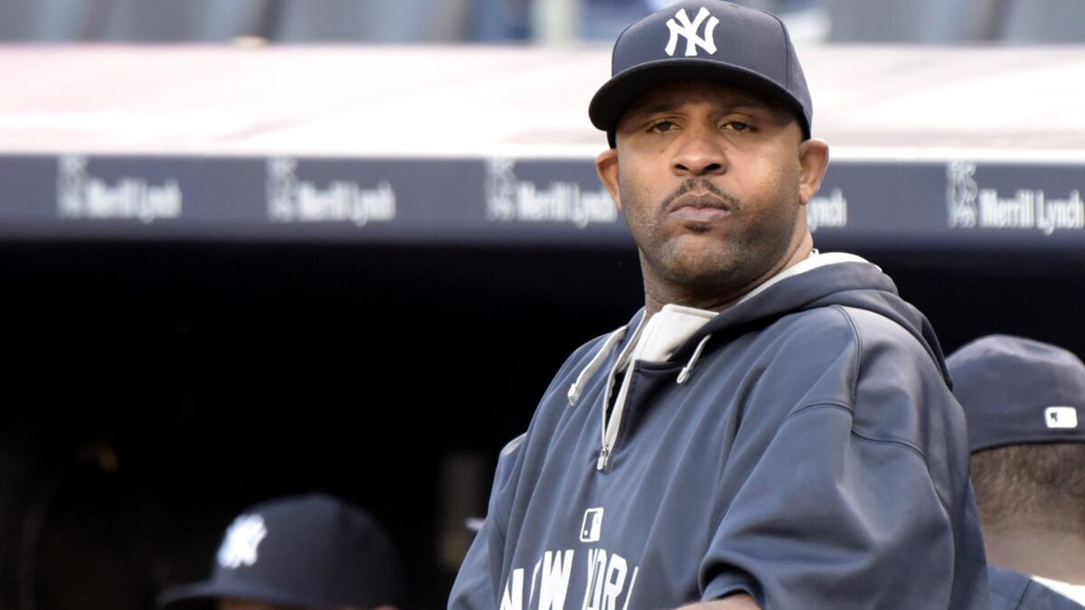 Yankees pitcher CC Sabathia watches from the dugout before a game against the Twins on Monday in New York.