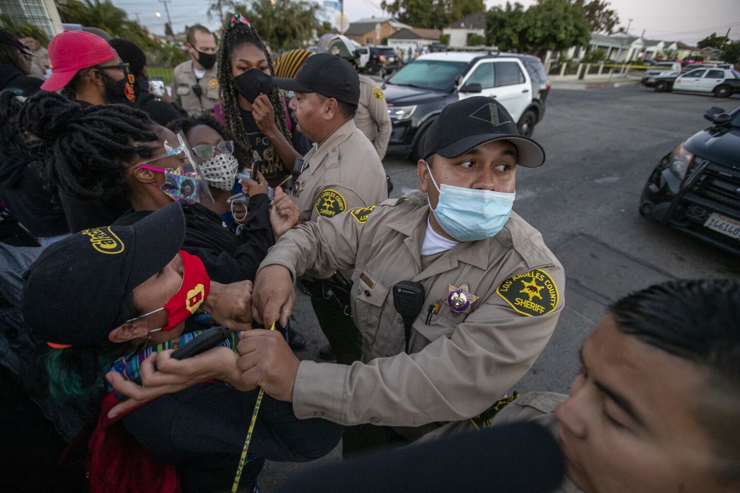 Residents face off with L.A. County sheriff's deputies.