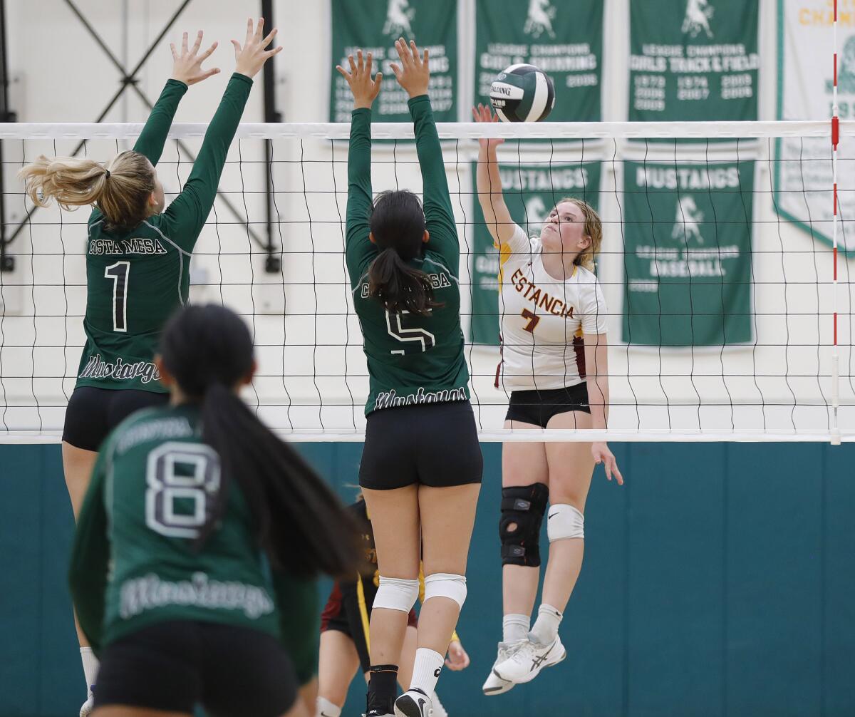 Estancia's Ruby Uchytil (7) makes a kill during the Battle for the Bell volleyball match against Costa Mesa on Thursday.