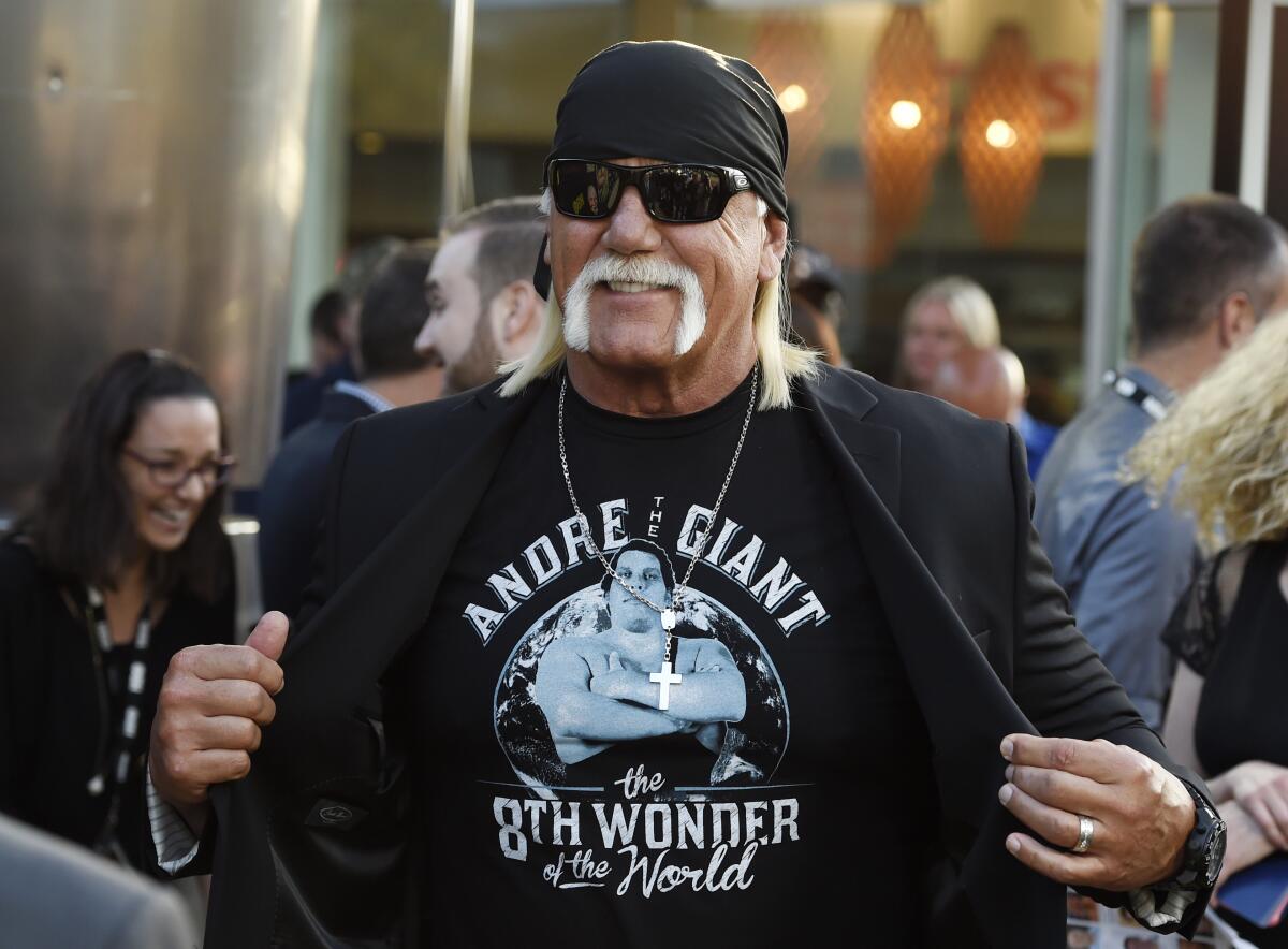 Hulk Hogan shows off his T-shirt with an image of Andre the Giant on it.