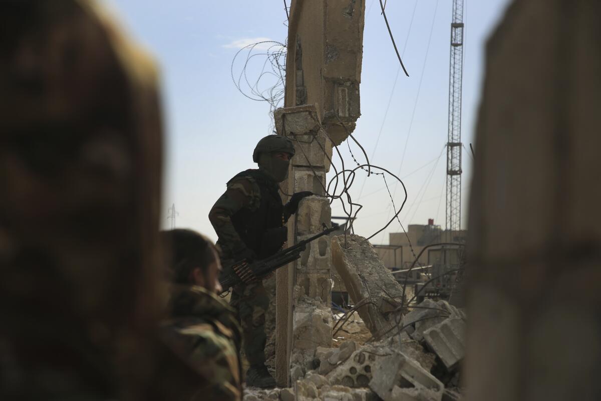 Militia member at a besieged prison in Syria