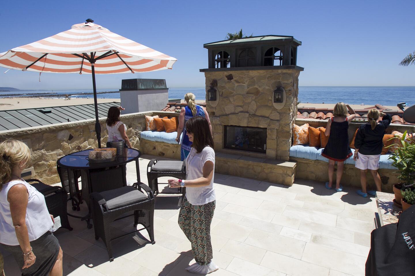 Guests take a look at the view from the rooftop patio at the Buntmann Residence at 2054 East Oceanfront during the Newport Harbor Home tour on Thursday, May 15. (Scott Smeltzer - Daily Pilot)