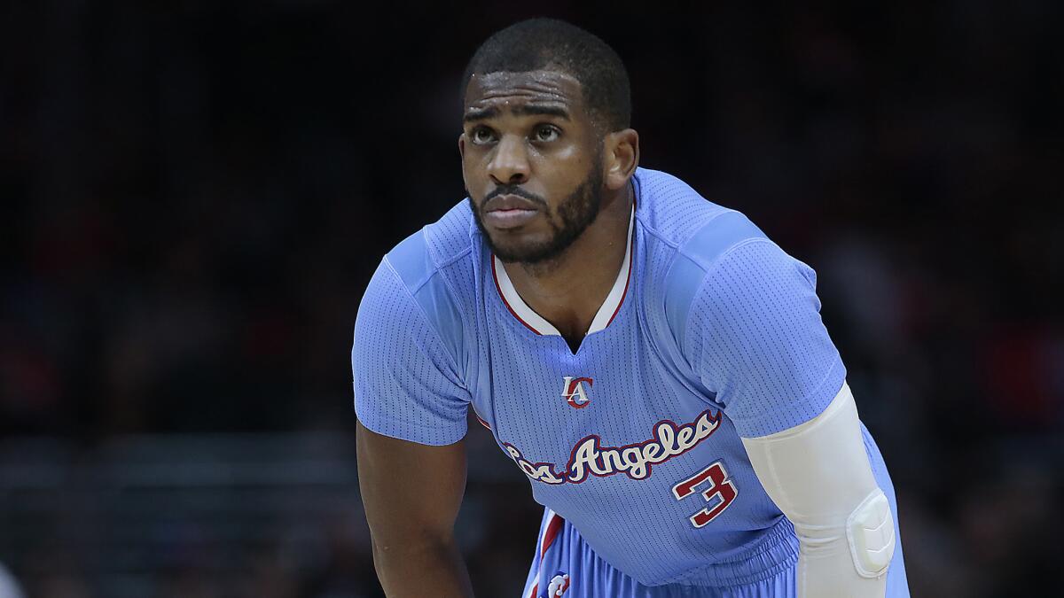 Clippers point guard Chris Paul looks on during a game against the Miami Heat at Staples Center on Jan. 11, 2015.