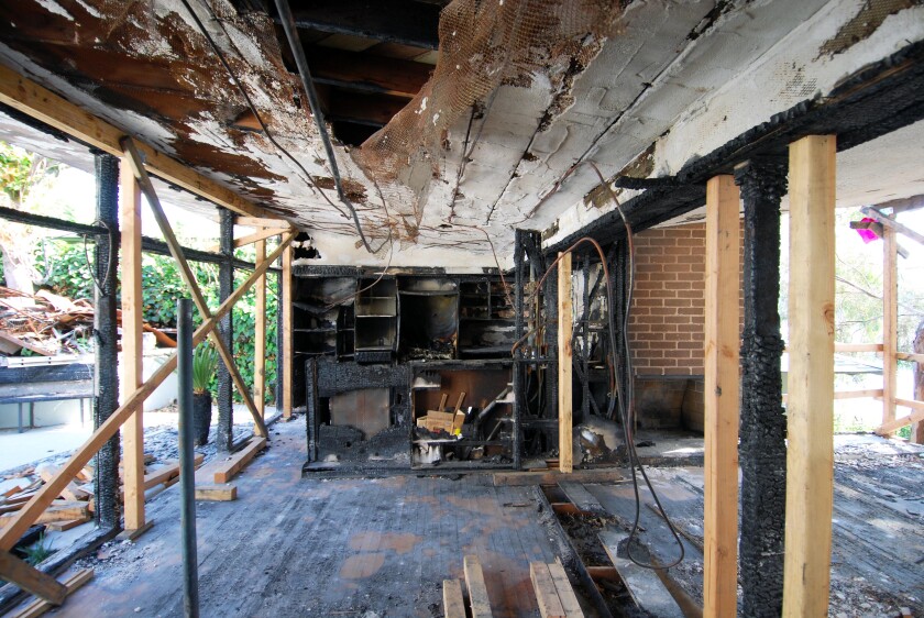 The gutted house after the fire, started by a hidden fireplace ember.