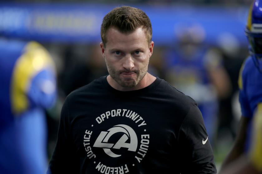 INGLEWOOD, CALIF. - DEC. 25, 2022. Rams head coach Sean McVay watches the team warm up before the game.