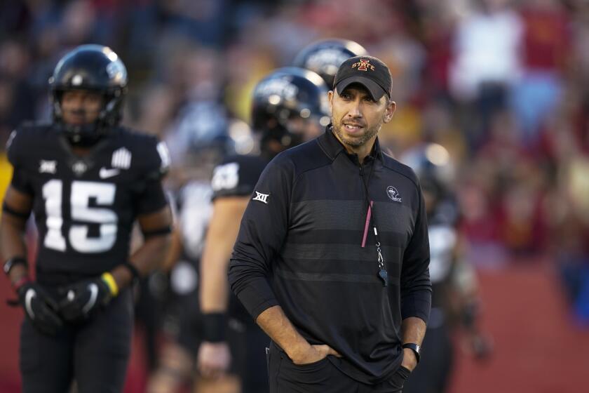 Iowa State head coach Matt Campbell stands on the field before an NCAA college football game against Texas, Saturday, Nov. 6, 2021, in Ames, Iowa. (AP Photo/Charlie Neibergall)