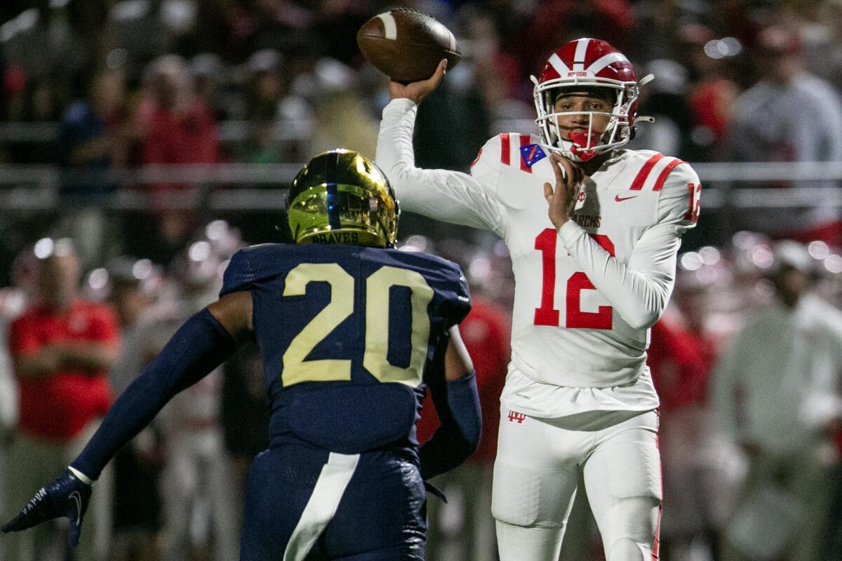 Mater Dei quarterback Elijah Brown (12) passes against St. John Bosco on Oct. 1 in Bellflower.