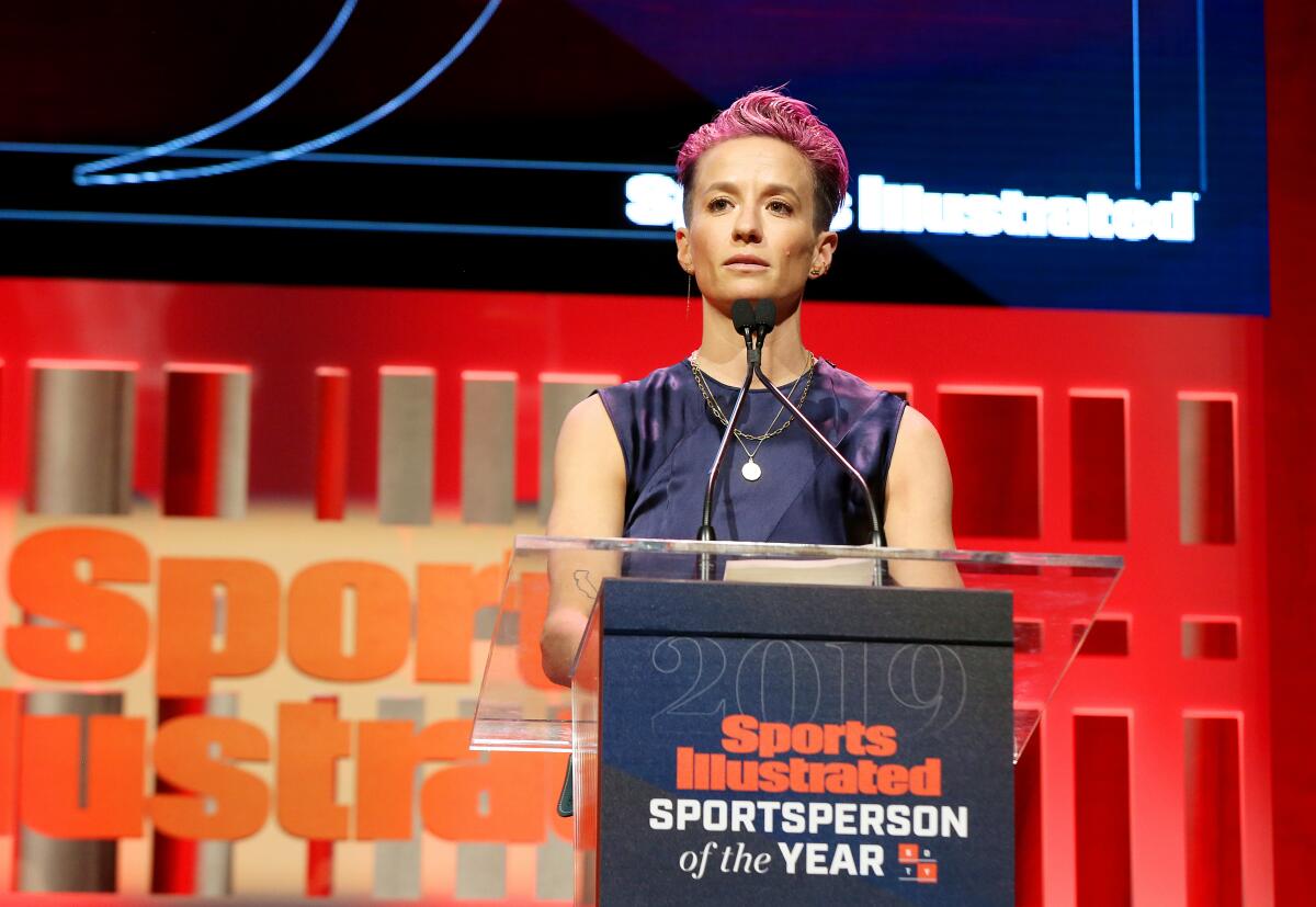 NEW YORK, NEW YORK - DECEMBER 09: Sports Illustrated Sportsperson of the Year Award Winner Megan Rapinoe speaks onstage during the Sports Illustrated Sportsperson Of The Year 2019 at The Ziegfeld Ballroom on December 09, 2019 in New York City. (Photo by Bennett Raglin/Getty Images for Sports Illustrated Sportsperson of the Year 2019) ** OUTS - ELSENT, FPG, CM - OUTS * NM, PH, VA if sourced by CT, LA or MoD **