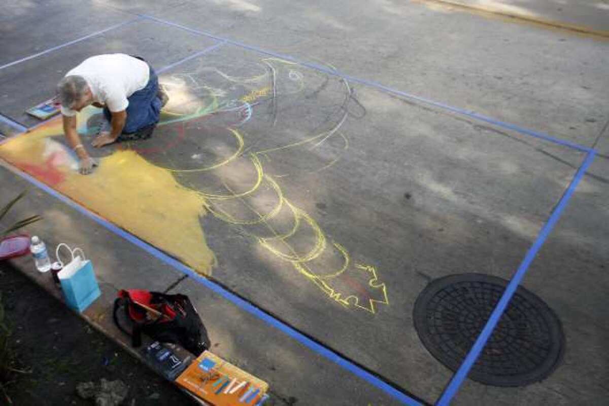 Oscar de Leon uses chalk to draw his 10' x 10' piece during Downtown Burbank ARTS Festival, which takes place on San Fernando Road between Magnolia Boulevard and Olive Avenue.