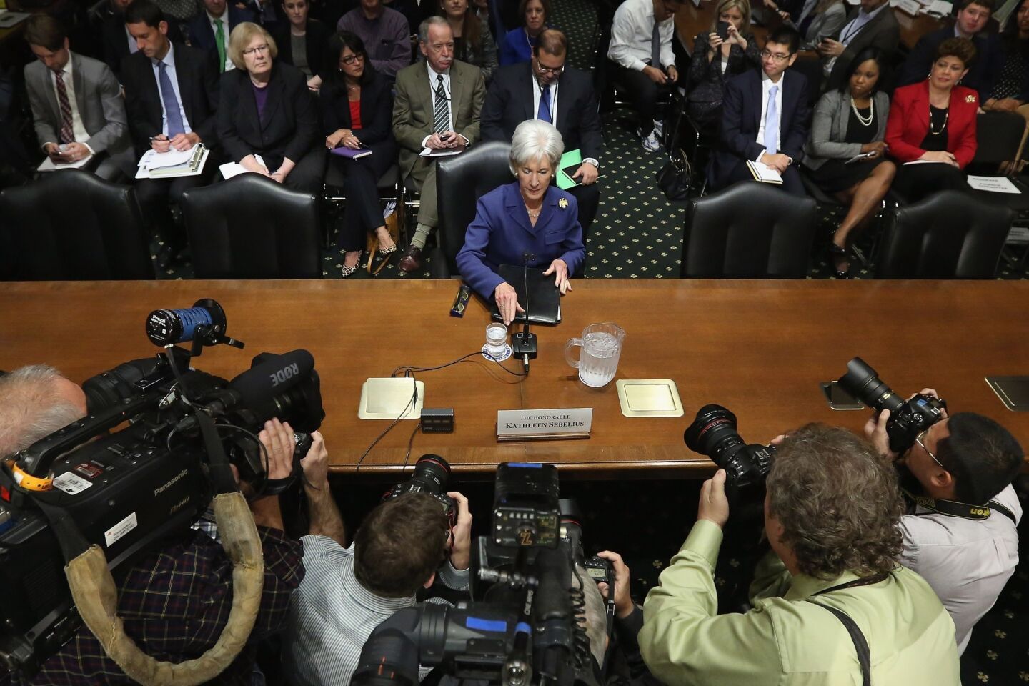 Health and Human Services Secretary Kathleen Sebelius prepares to testify about the error-plagued launch of healthcare.gov before the Senate Finance Committee on Capitol Hill.