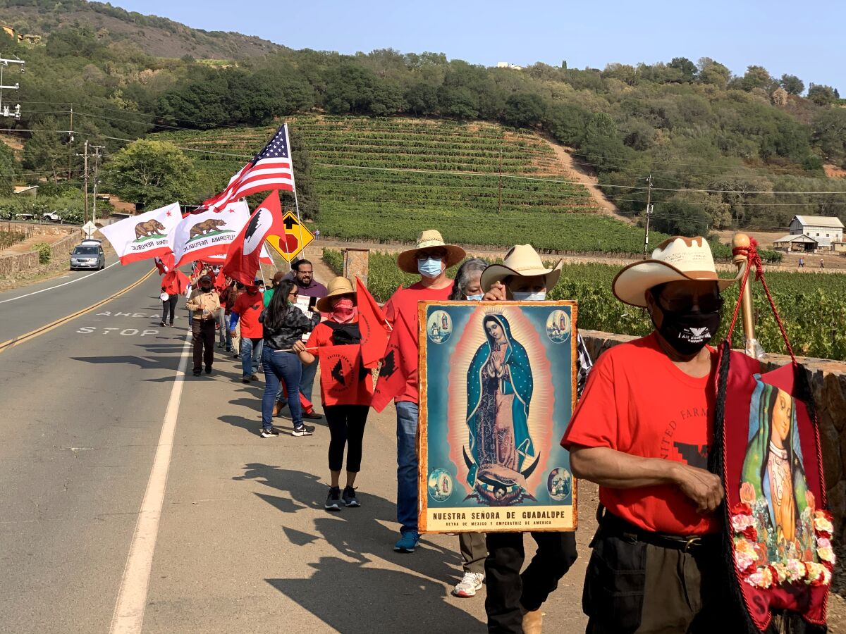 Workers march in protest outside the French Laundry