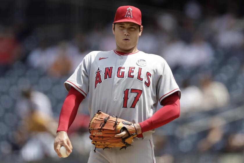 Los Angeles Angels pitcher Shohei Ohtani reacts during the third inning of the first baseball game.