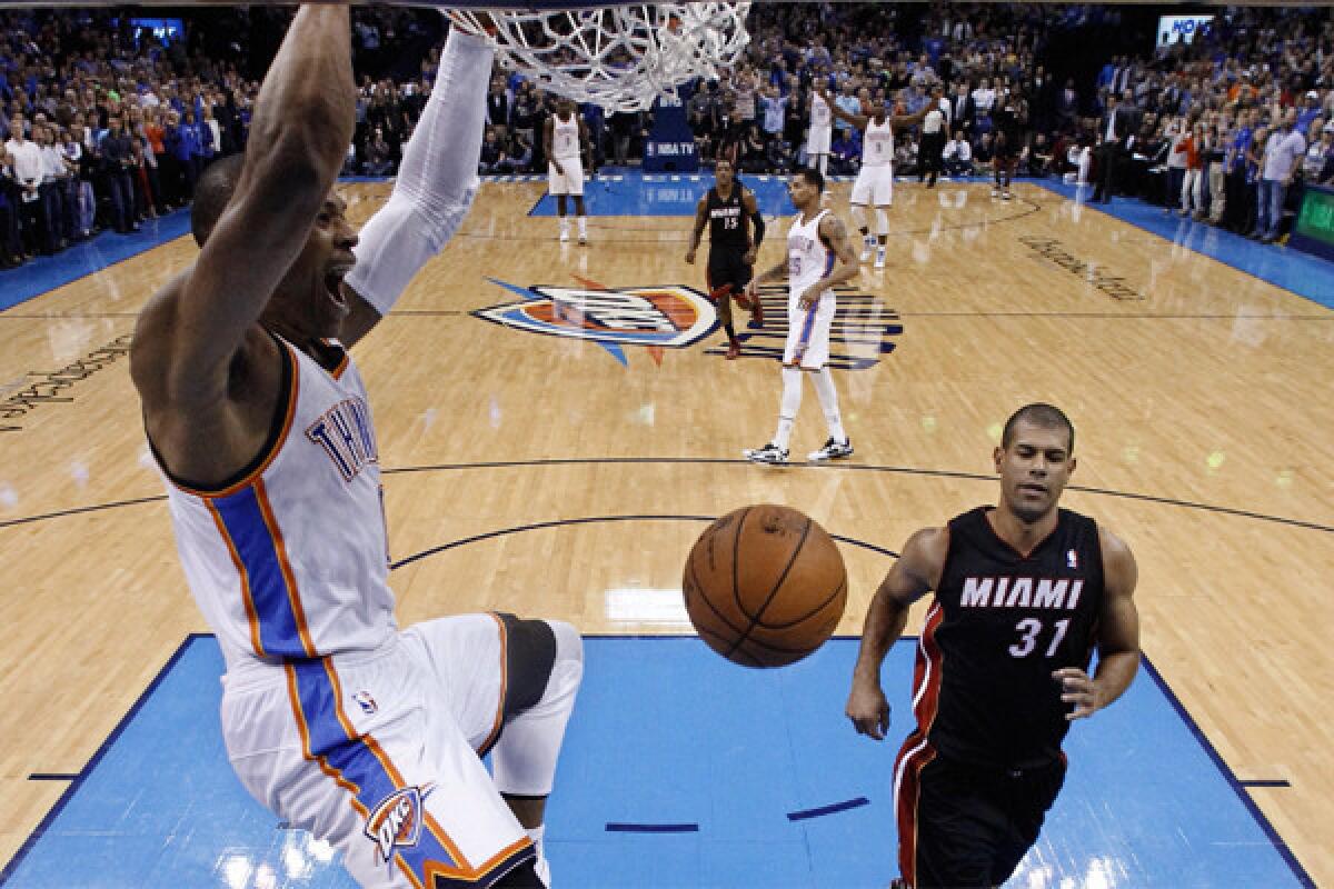 Oklahoma City guard Russell Westbrook dunks Friday night against the Heat in his first game back after missing the previous 27 after knee surgery.