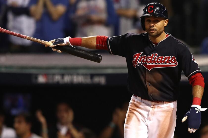 Cleveland Indians' Coco Crisp celebrates after scoring a run on an RBI single hit by Carlos Santana during the third inning against the Chicago Cubs in Game 7 of the 2016 World Series on Nov. 2.