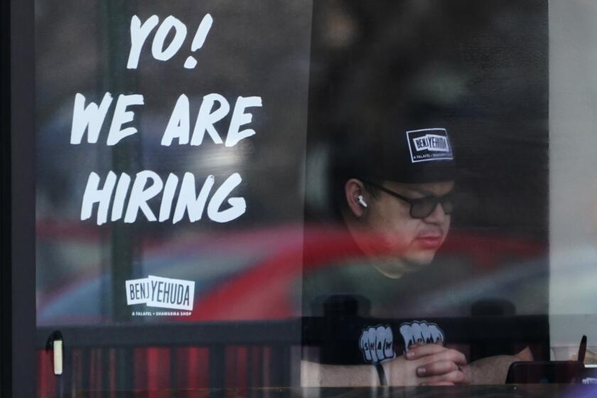 A hiring sign is displayed at a restaurant in Schaumburg, Ill., Friday, April 1, 2022. More Americans applied for unemployment benefits last week, and while layoffs remain low, it's the fifth straight week claims have topped the 230,000 mark. Applications for jobless aid for the week ending July 2 rose to 235,000, up 4,000 from the previous week, the Labor Department reported Thursday, July 7. (AP Photo/Nam Y. Huh, File)