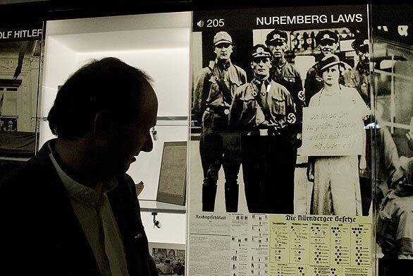 Randy Schoenberg looks over the Nuremberg Laws in one of the galleries in the new Los Angeles Museum of the Holocaust in Pan Pacific Park in Los Angeles. Schoenberg is president of the museum.
