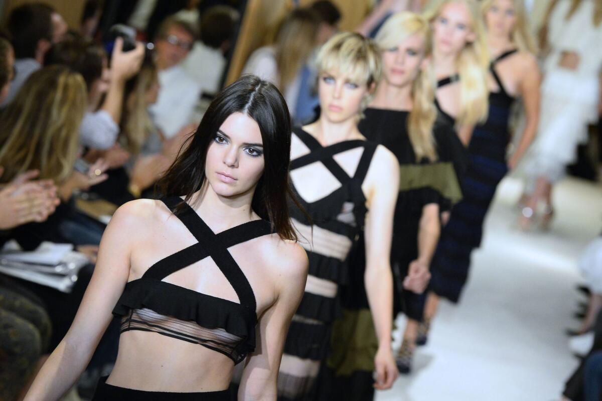 Kendall Jenner, left, and other models show off clothes at Sonia Rykiel's Paris Fashion Week presentation on Sept. 29.