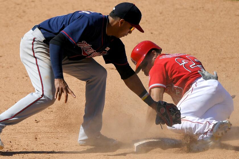 Twins shortstop appears to apply a late tag to the Angels' Ben Revere on a steal attempt in the ninth inning, but a video replay overturned the safe call and ended the game.