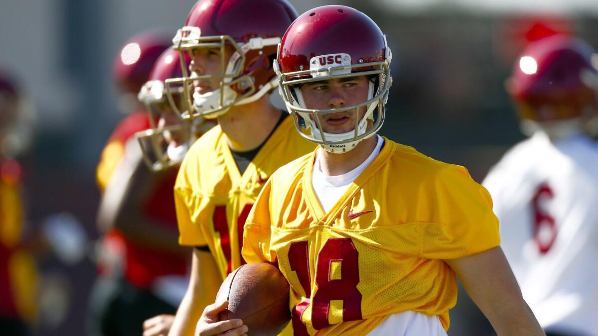 USC quarterback JT Daniels carries a ball as the Trojans open up the first day of Fall Camp at the USC on Aug. 3.