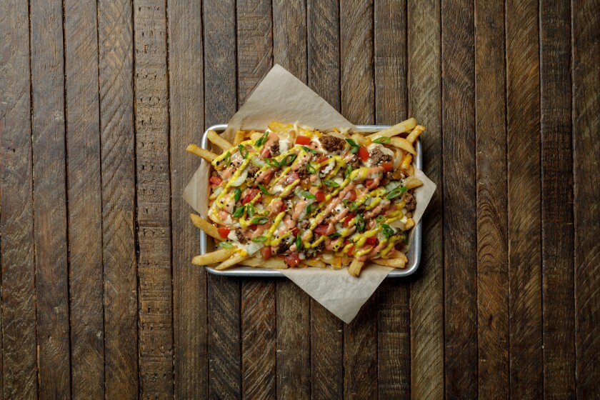 Cheeseburger Fries are now on the menu at Lazy Dog Restaurant & Bar.