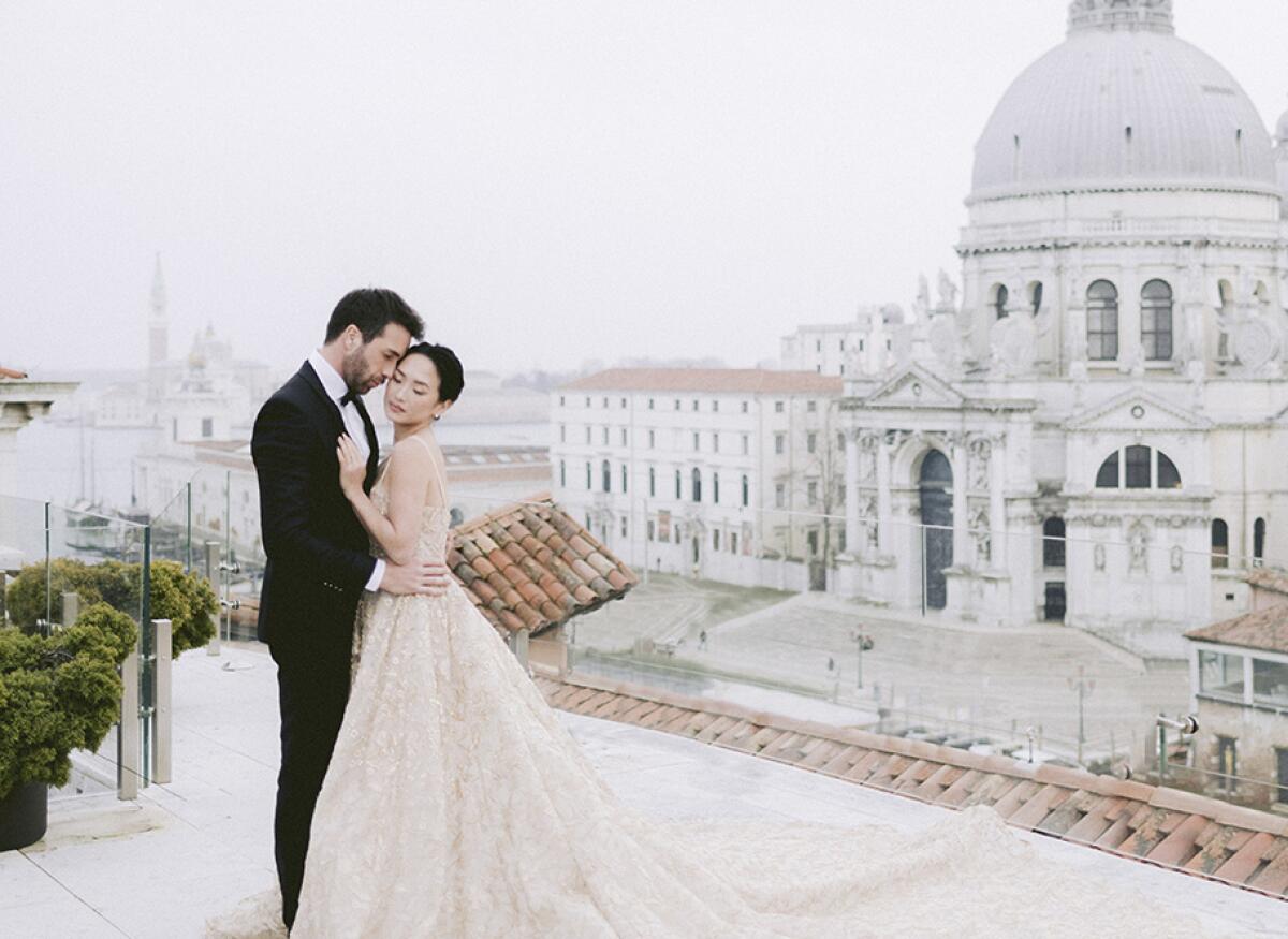 A bride and groom marry on the roof of Gritti Palace in Venice.