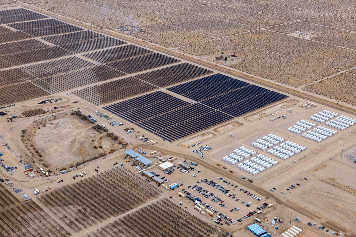 An aerial view of solar panels and lithium-ion battery units