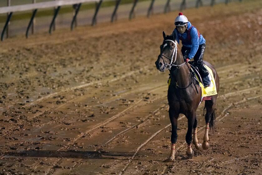 Kentucky Derby entrant Keepmeinmind works out at Churchill Downs Thursday, April 29, 2021, in Louisville, Ky. The 147th running of the Kentucky Derby is scheduled for Saturday, May 1. (AP Photo/Charlie Riedel)