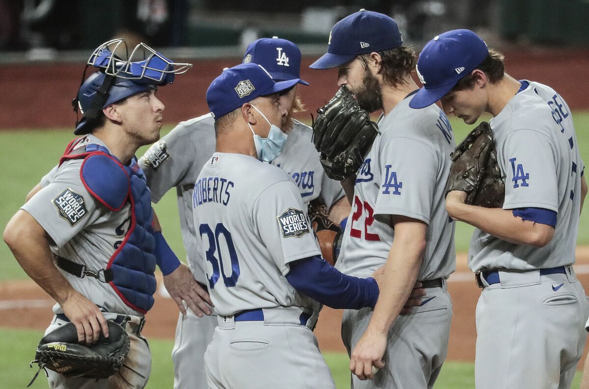 Dodgers manager Dave Roberts talks with Clayton Kershaw moments before he removes him.