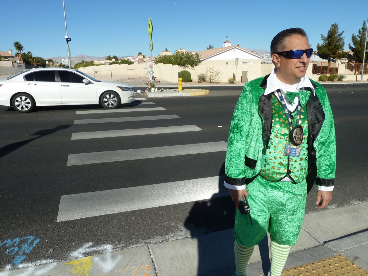 Tom Rainey walks across the street in Las Vegas dressed as a leprechaun as part of a police operation to see if motorists will stop for him in a city with a rising toll of pedestrian deaths. They didn't.