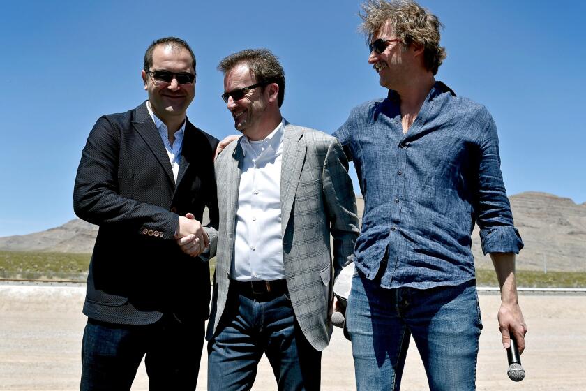 From left, Hyperloop One co-founder and Executive Chairman Shervin Pishevar, Chief Executive Rob Lloyd and co-founder and then-Chief Technology Officer Brogan BamBrogan at a company event in May.