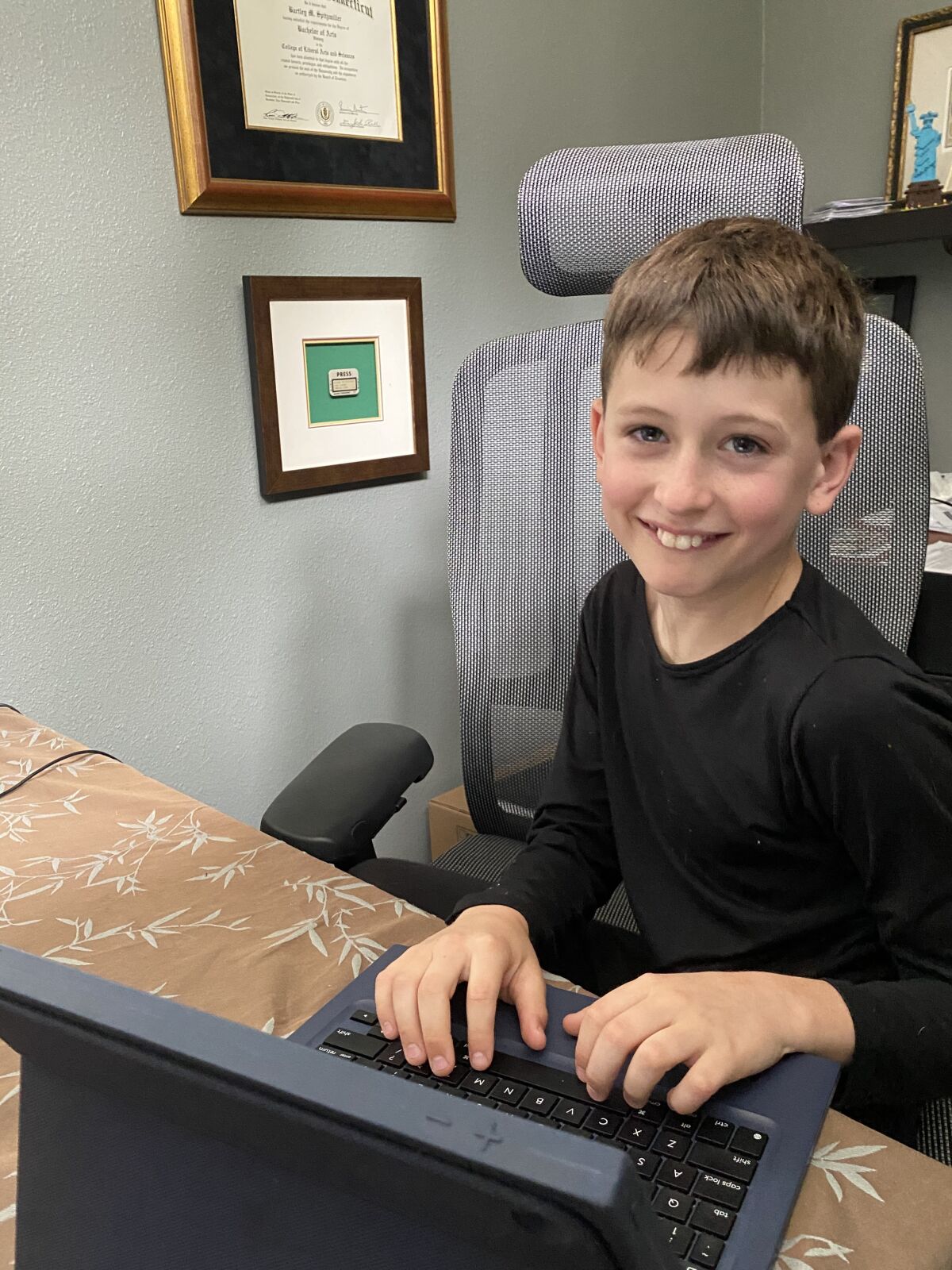 Beau, a Solana Santa Fe School student, works from home.