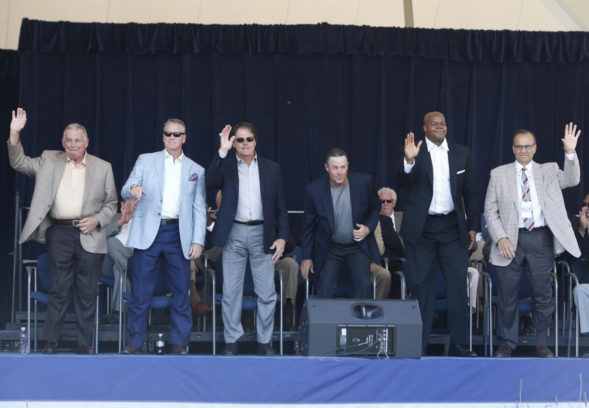 Baseball Hall of Fame electees Bobby Cox, Tom Glavine, Tony La Russa, Greg Maddux, Frank Thomas and Joe Torre are introduced during an awards ceremony at Doubleday Field on Saturday in Cooperstown, N.Y.