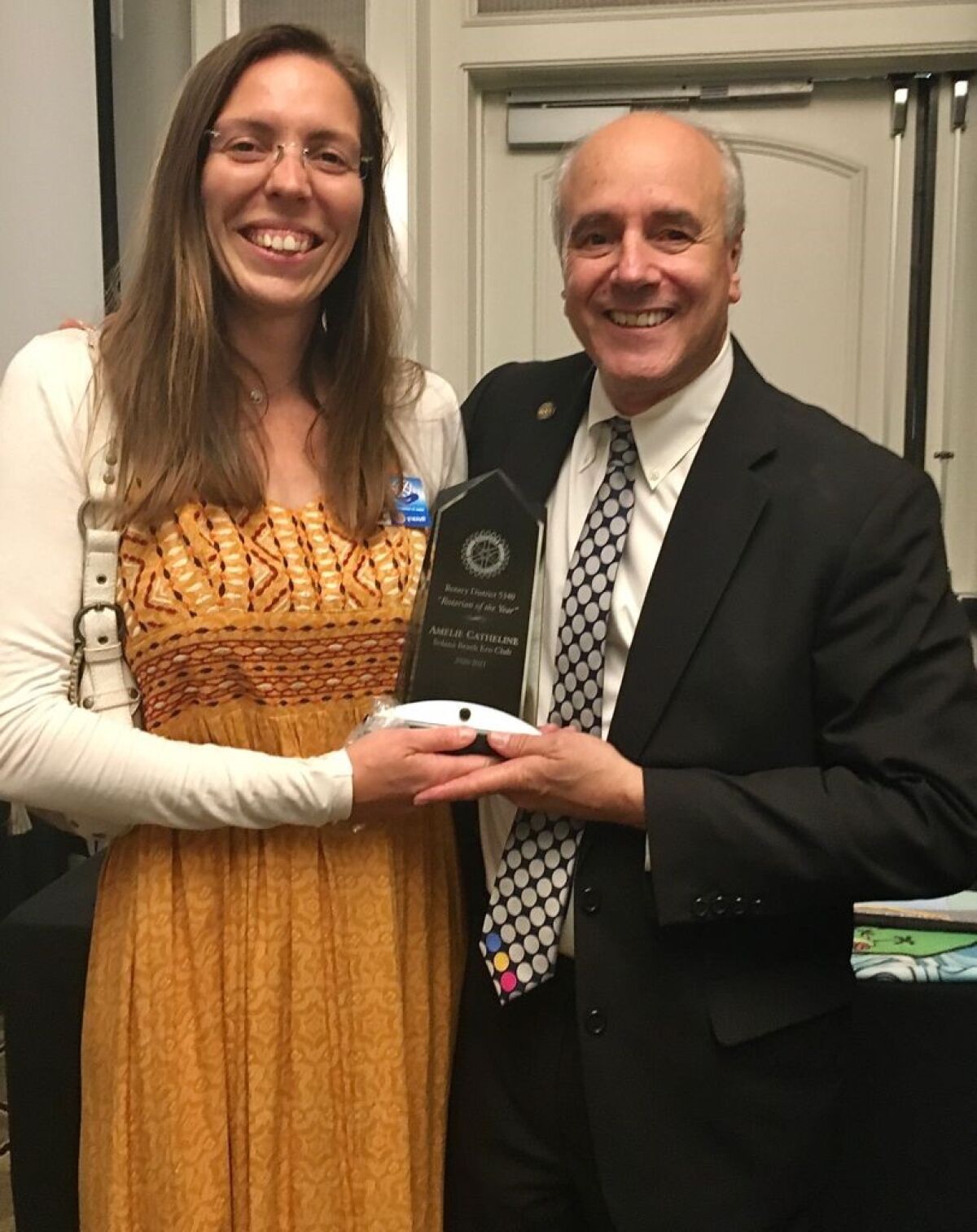 Amélie Catheline, Ph.D. receives her award from Steve Weitzen, District Governor of Rotary District 5340.
