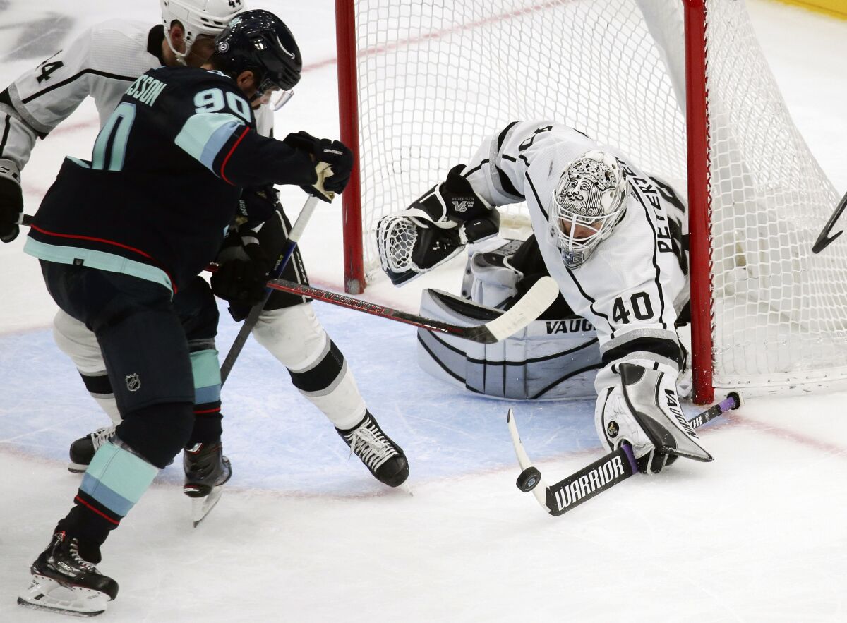 Kings goalie Cal Petersen makes a save against Kraken left wing Marcus Johansson (90) during the third period.