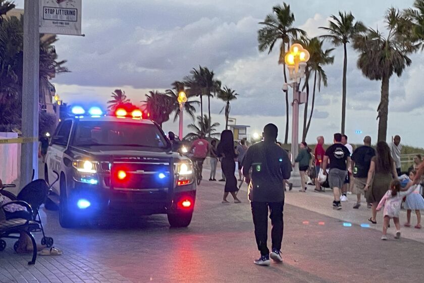 Police respond to a shooting near the Hollywood Beach Broadwalk in Hollywood, Fla., Monday evening, May 29, 2023. (Mike Stocker/South Florida Sun-Sentinel via AP)