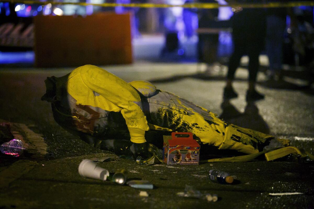 Police tape marks off a fallen statue from the Confederate monument in Portsmouth, Va., on June 10. 