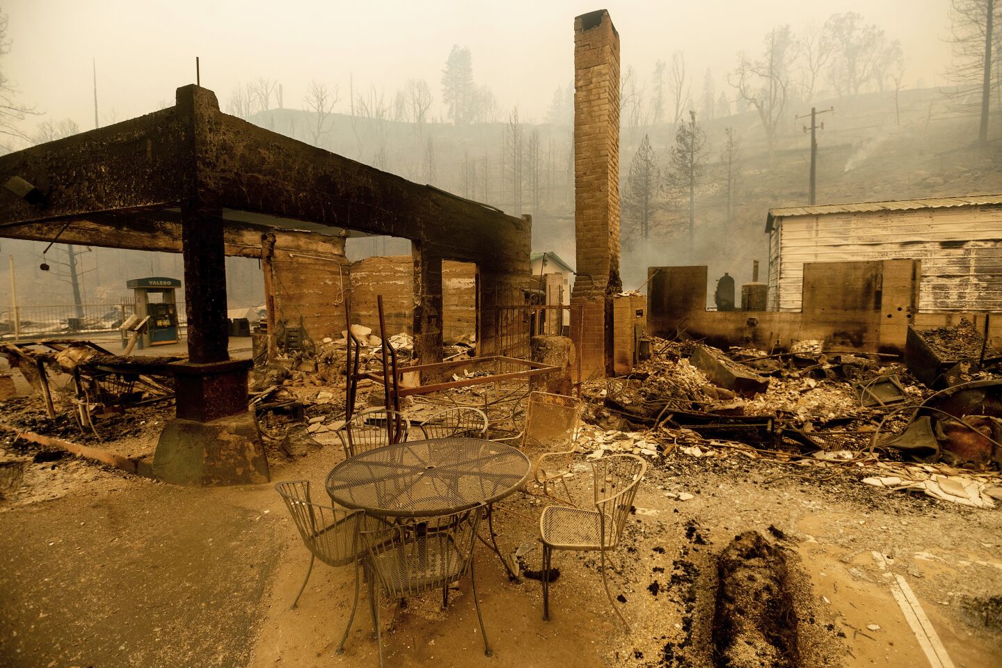 A table stands outside the destroyed Cressman's General Store after the Creek Fire burned through Fresno County.