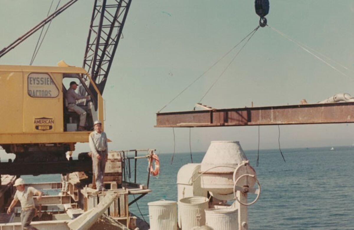 A crew works on the Ocean Beach Pier's construction in 1965. It opened in July 1966.