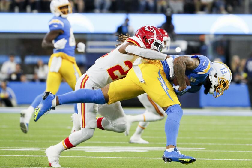 Los Angeles, CA - November 20: Los Angeles Chargers wide receiver Keenan Allen (13) runs after a catch while defended by Kansas City Chiefs safety Justin Reid (20) during the first half at SoFi Stadium on Sunday, Nov. 20, 2022 in Los Angeles, CA. (Robert Gauthier / Los Angeles Times)
