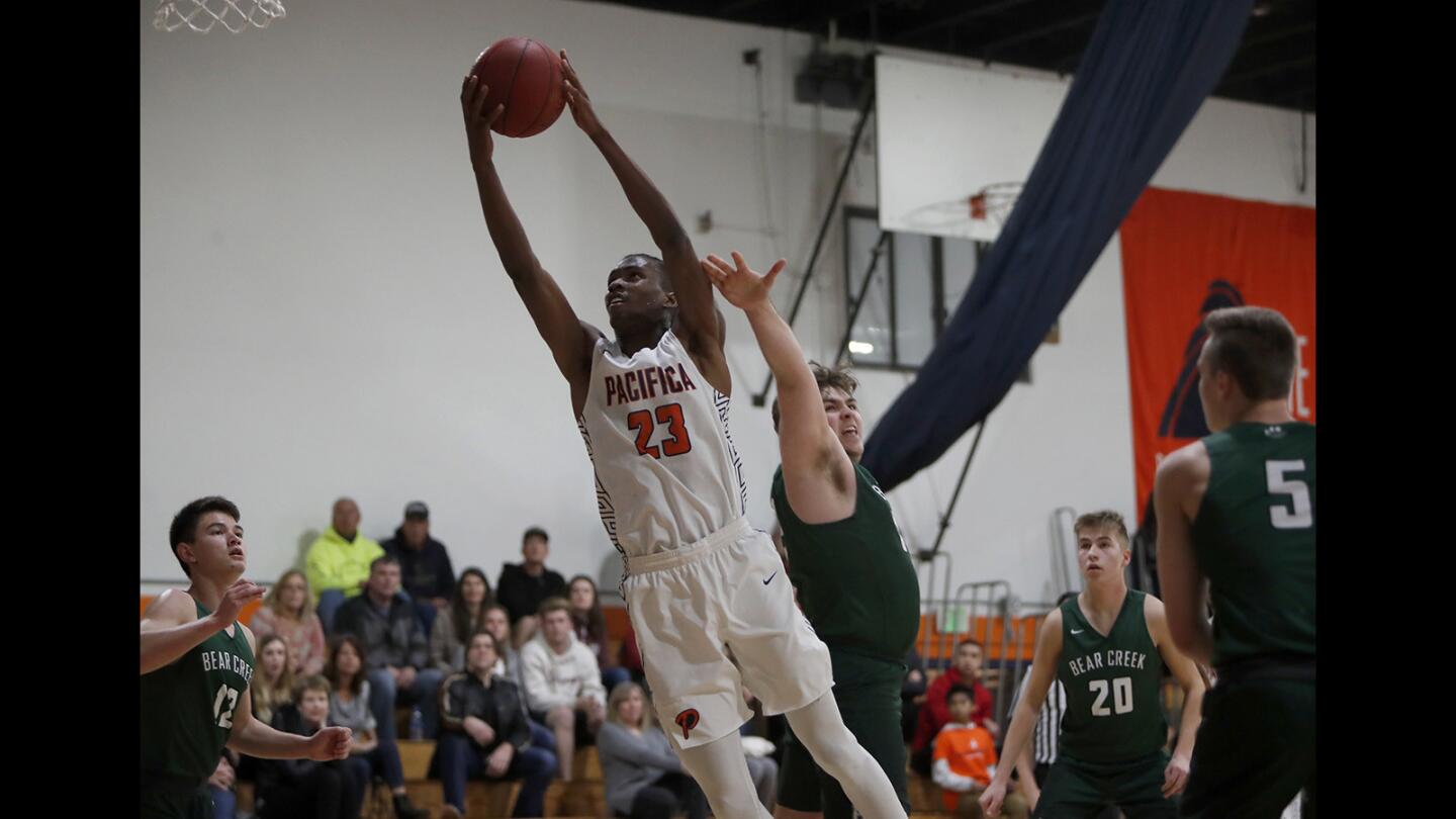 Pacifica Christian Orange County High's Judah Brown (23) scores against Bear Creek of Redmond, Wash., during the first half in a nonleague game on Friday, December 28, 2018.
