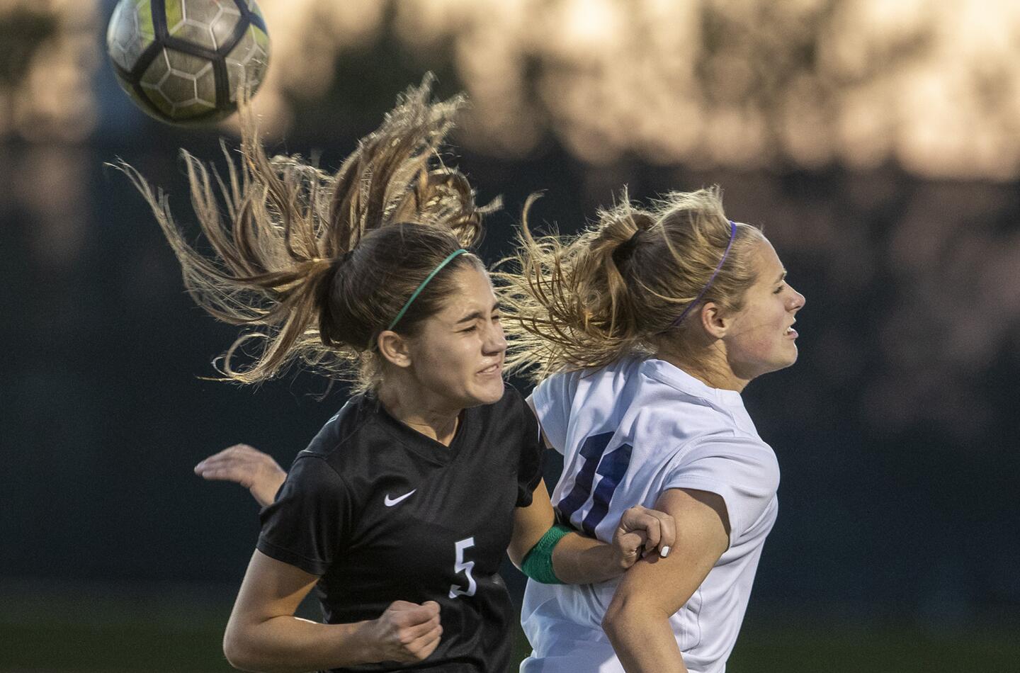 Sage Hill School's Lexi Van Den Bosch, left, heads a ball against Pacifica Christian Orange County's Leila Bahnsen during a San Joaquin League match at home Thursday.