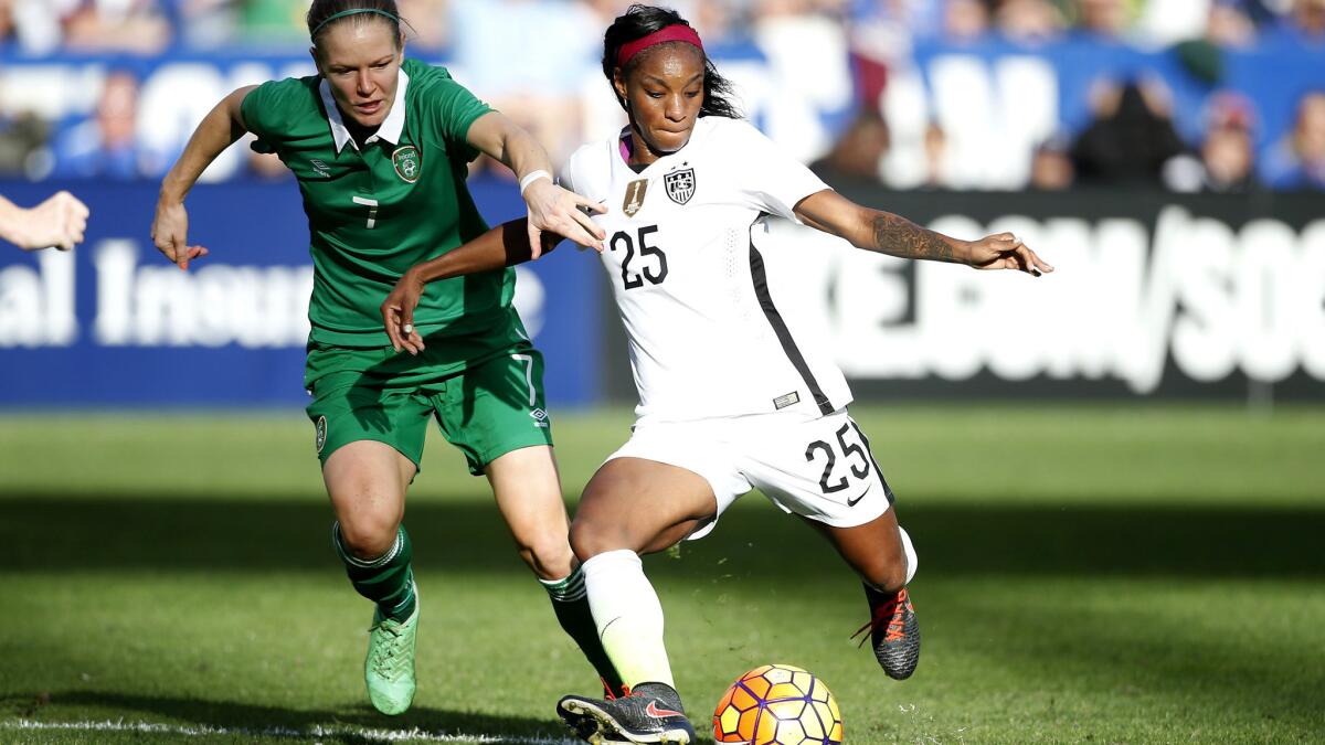 U.S. midfielder Crystal Dunn looks to pass against Ireland's Diane Caldwell during their exhibition game Saturday.