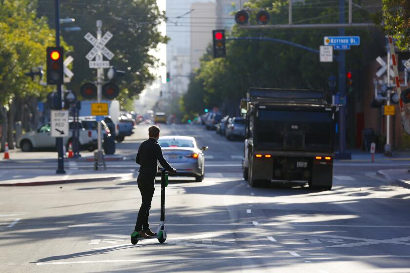 Besides using a motorized scooter to get to and from work, Justin Vaiciunas who lives in downtown, San Diego figures he rides the scooters on average 4-times a day.
