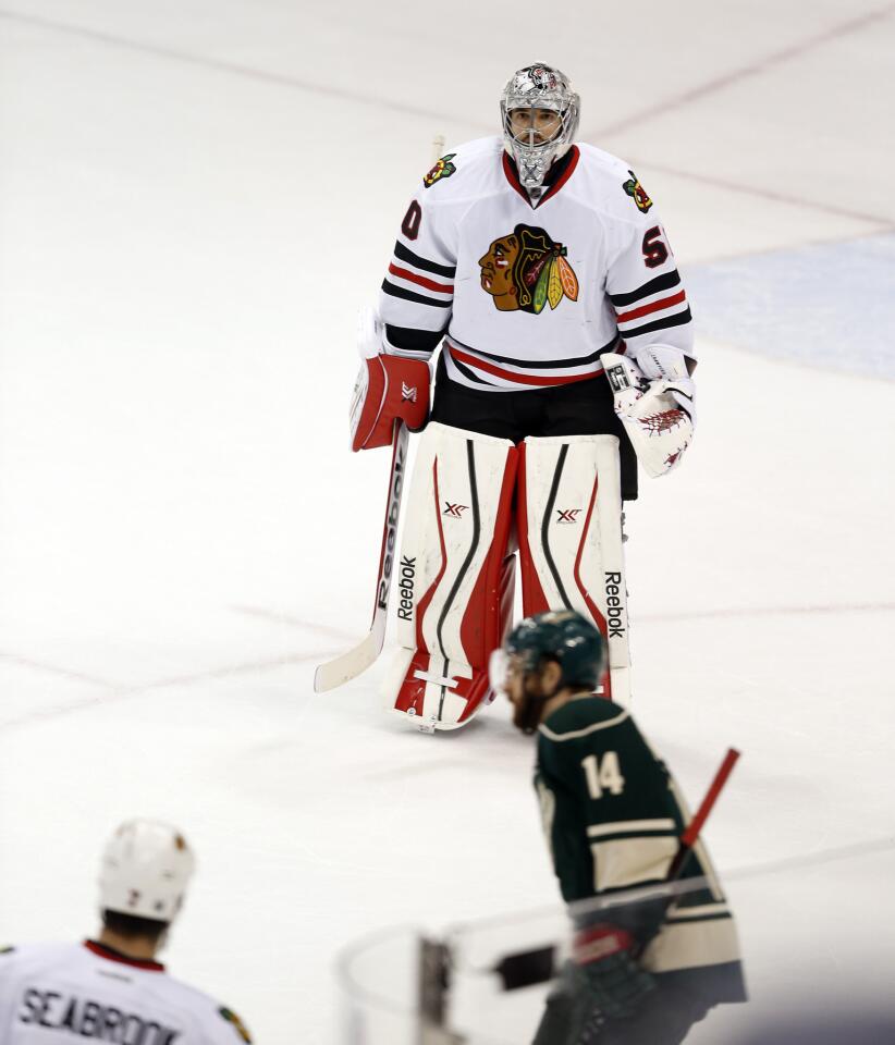 Corey Crawford skates off the ice after a 4-0 loss to the Wild in Game 3.
