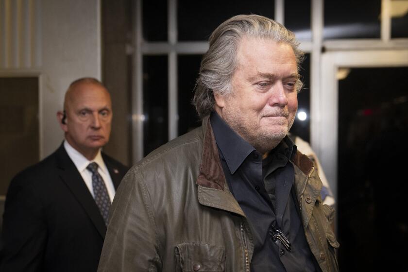 Former White House strategist Steve Bannon leaves court, Tuesday, Oct. 4, 2022, in New York. (AP Photo/John Minchillo)